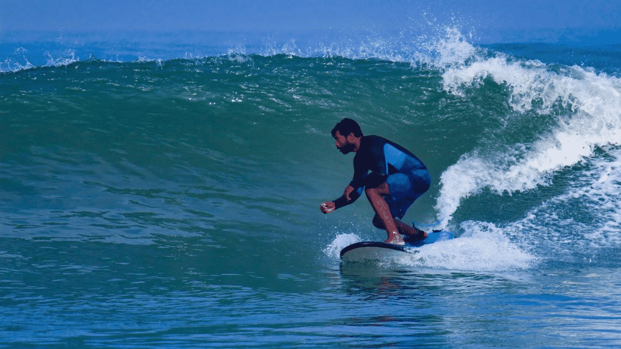 Surfer surfing at Mulki
